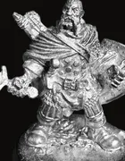 An unpainted pewter miniature of Garrin Vosk — a bearded warrior pointing forward with one hand, a longsword held low in the other, a large kite shield on his arm, wearing layered scale and cloth armor and a cloak, standing on a rocky round base